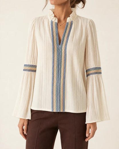 Women's ivory vintage blouse with embroidered trim, straight front fit.