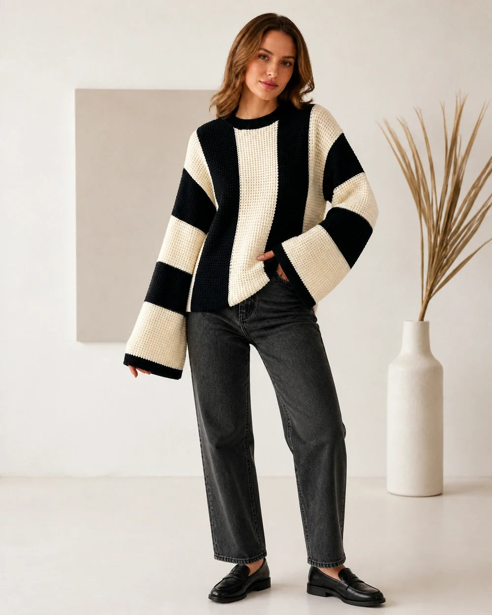 Women's beige black-and-cream color-block sweater, full-length view