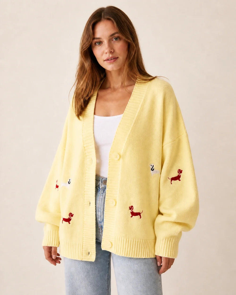 Women's pale yellow dachshund motif cardigan, worn front view