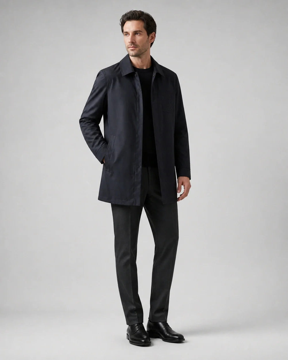 Dark blue mid-length coat for men, worn full-length hero view.