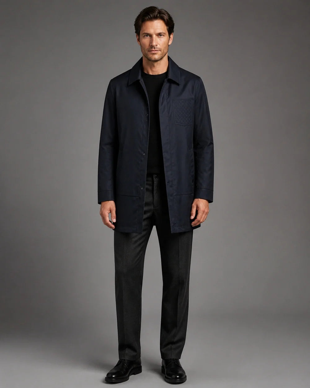 Dark blue mid-length coat for men, front view.