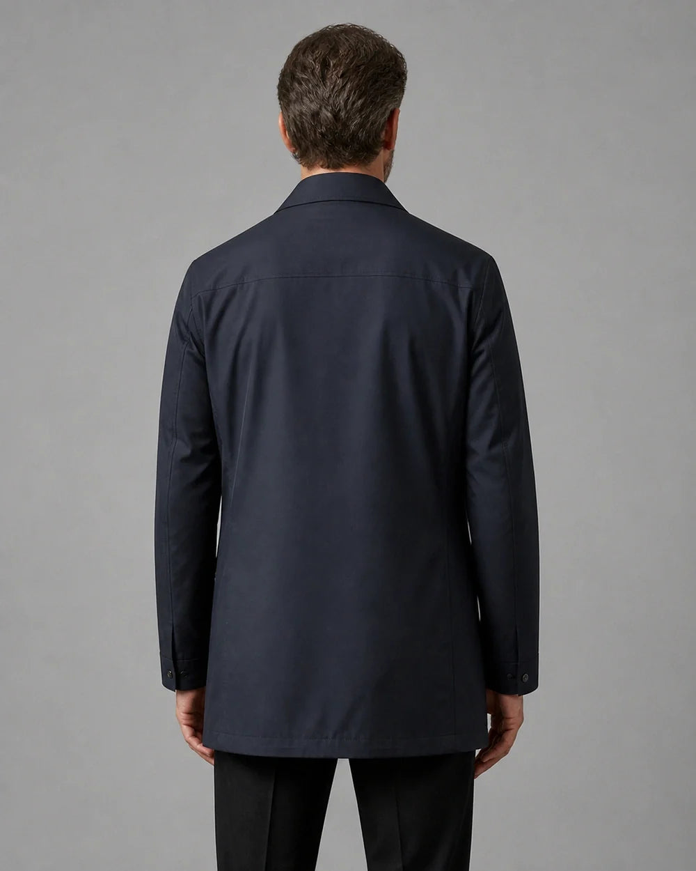 Dark blue mid-length coat for men, back view.