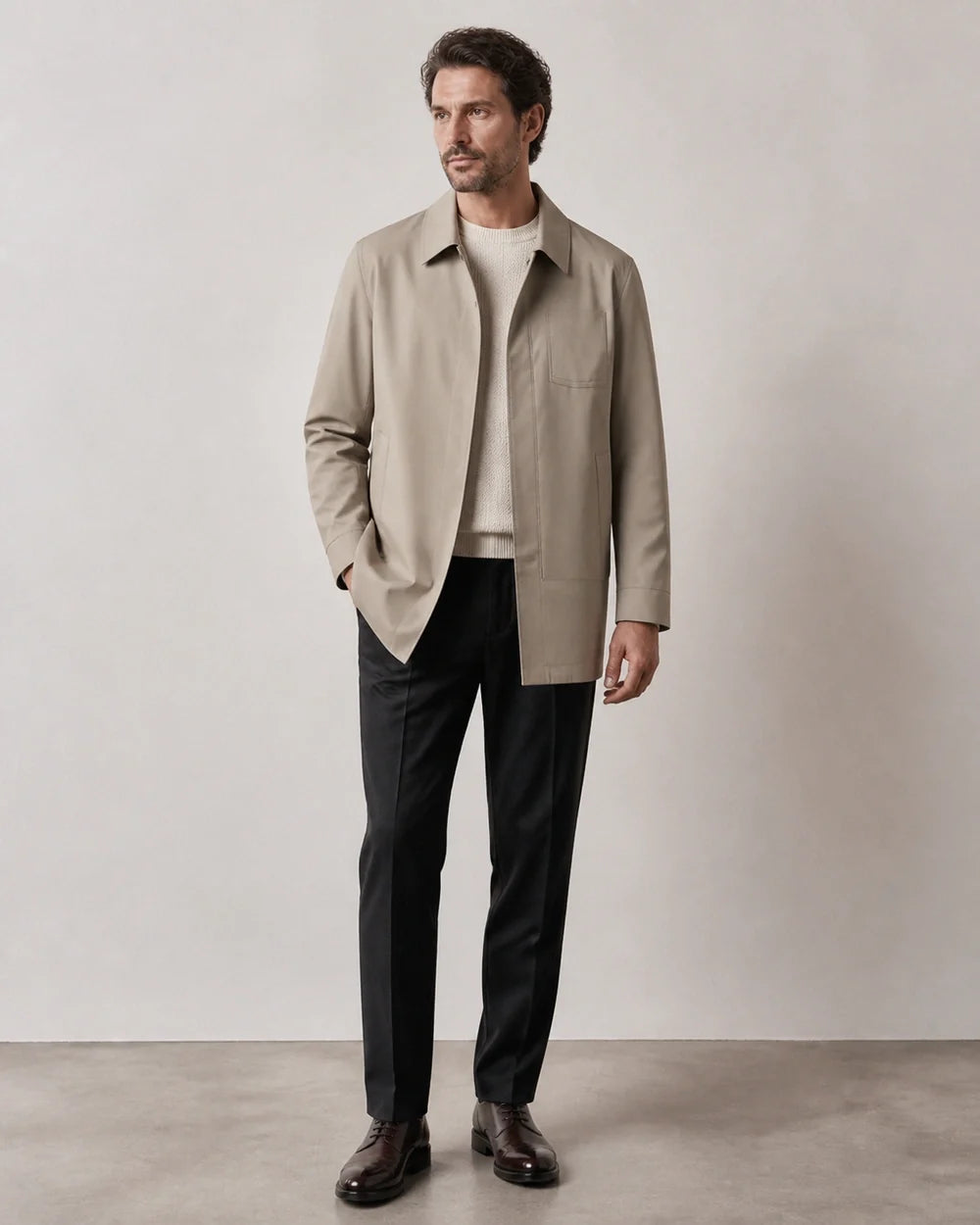 Khaki mid-length coat for men, worn full-length hero view.