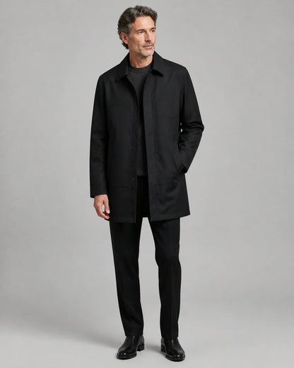 Black mid-length coat for men, worn full-length hero view.