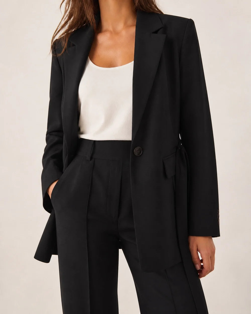 Black relaxed blazer and trousers set for women, tailoring detail