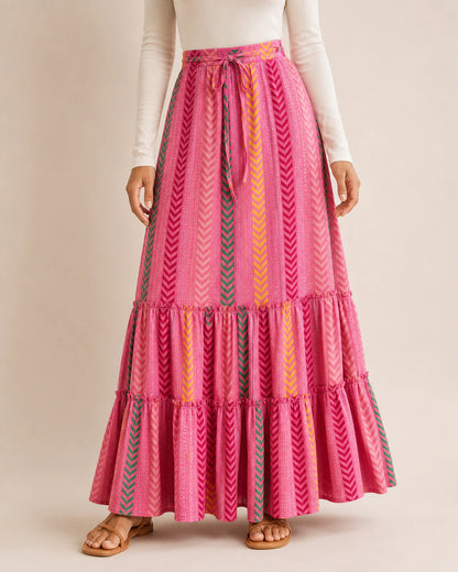 Women’s Pink printed tiered maxi skirt, front product view.
