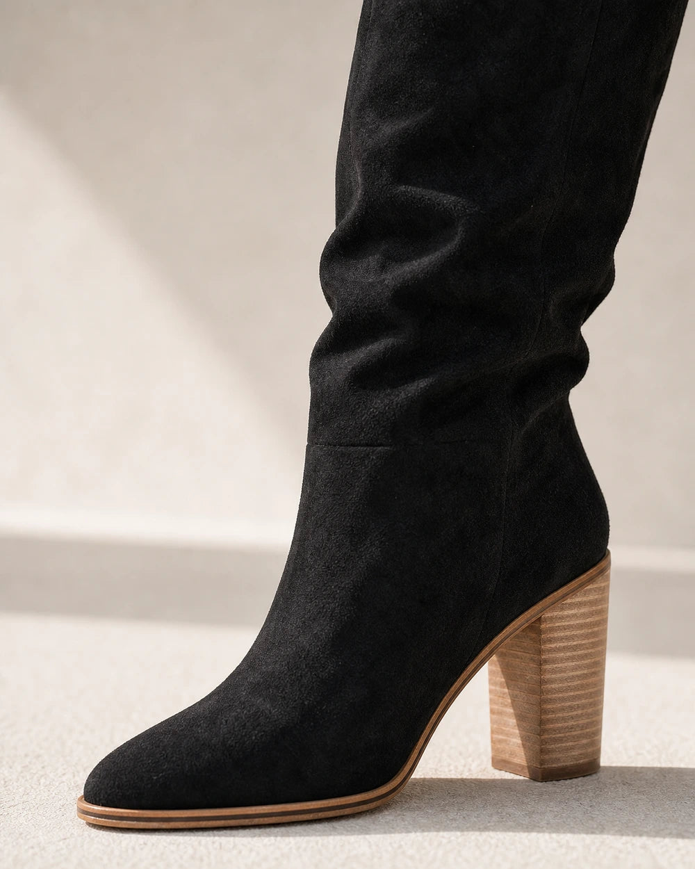 Women's black suede-effect knee-high boot, toe and block-heel detail.